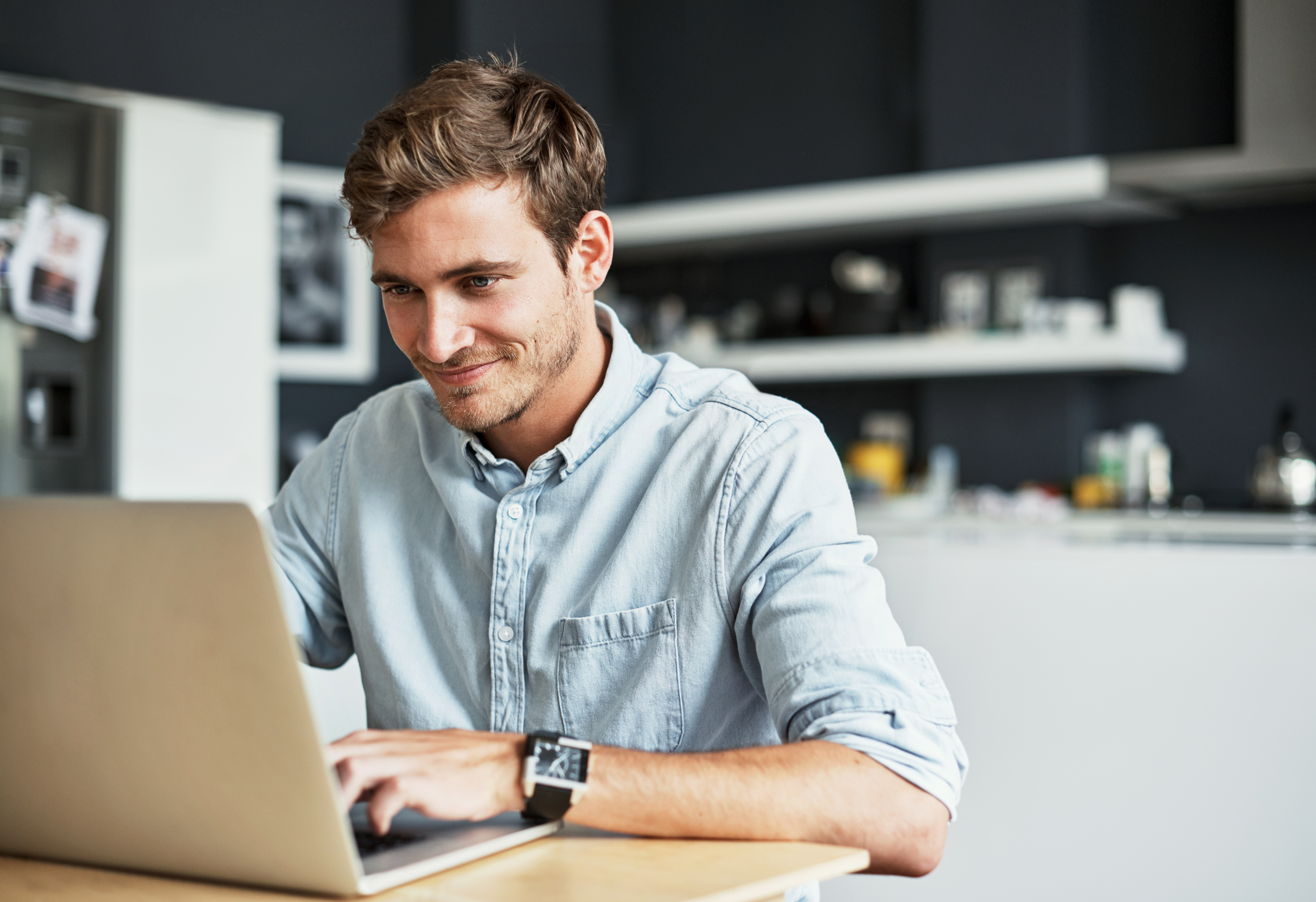 A man using a laptop to review estimates