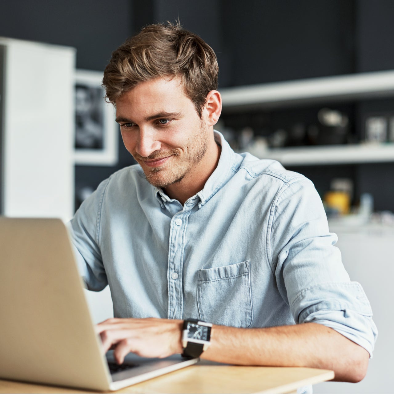 A man using a laptop to review estimates