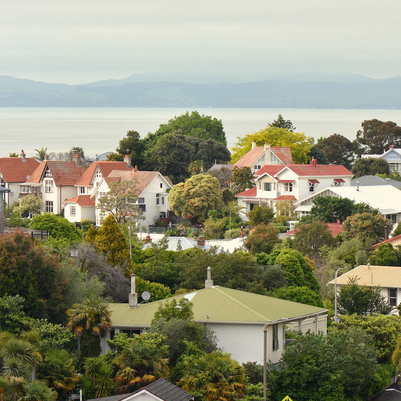 The image shows a close-up of a modern door handle and keyhole on an open door.