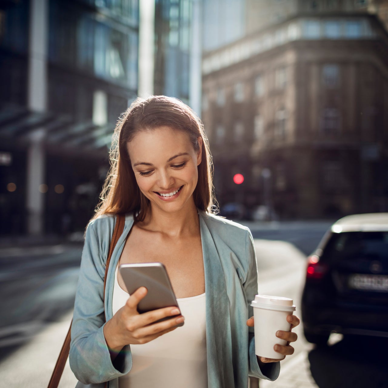 Woman checking her claim's status on her mobile device