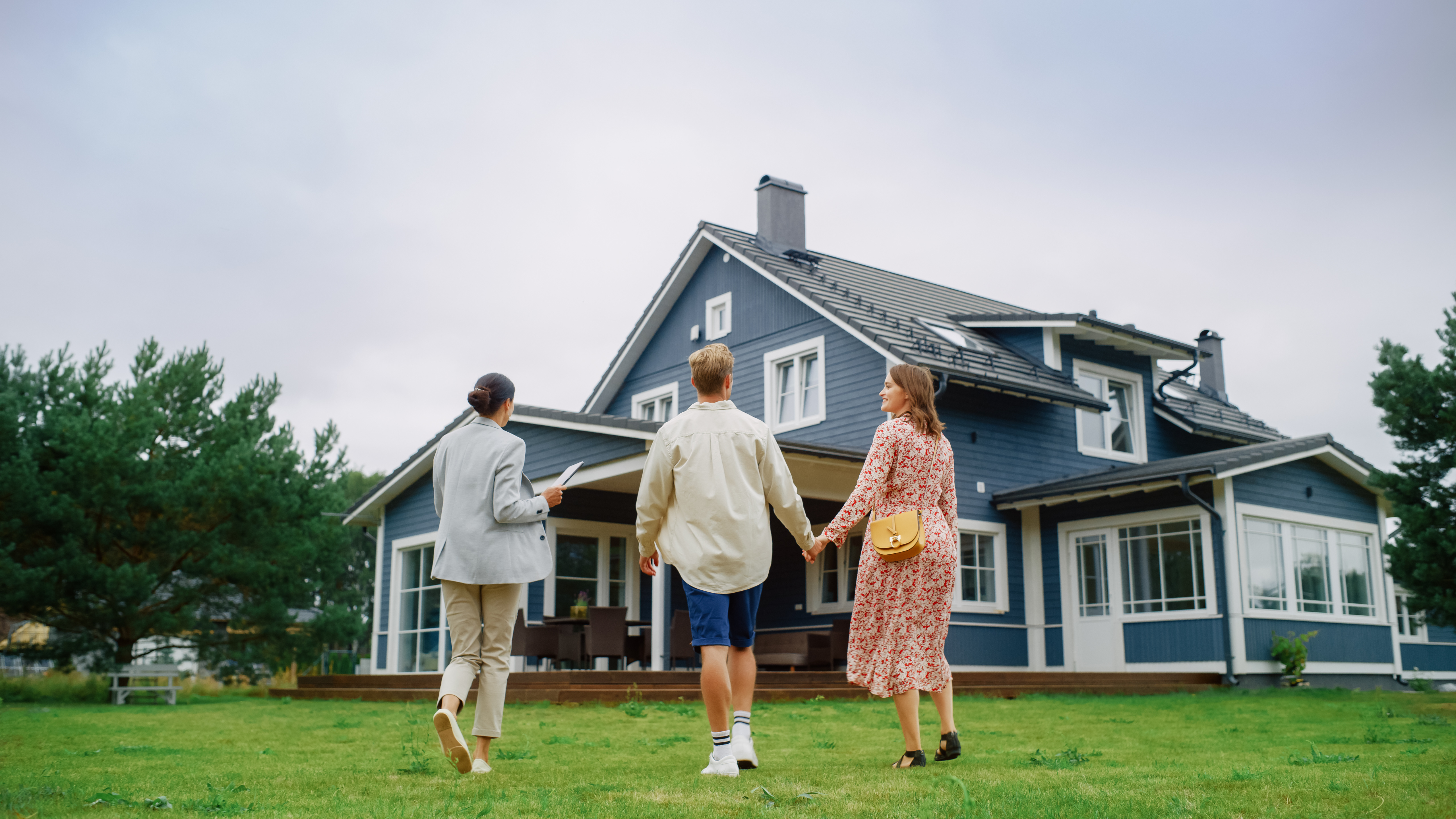 Young homebuyers walking into their new home.