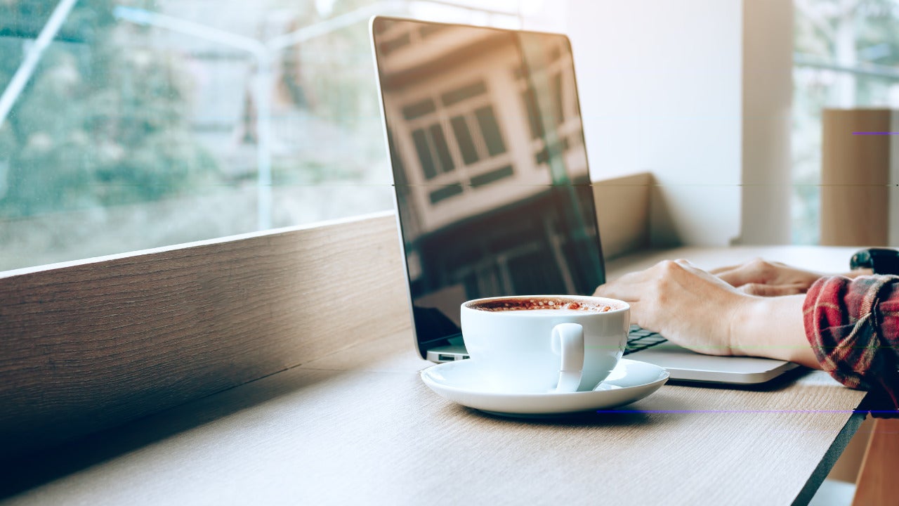 Image of someone working remote with a laptop