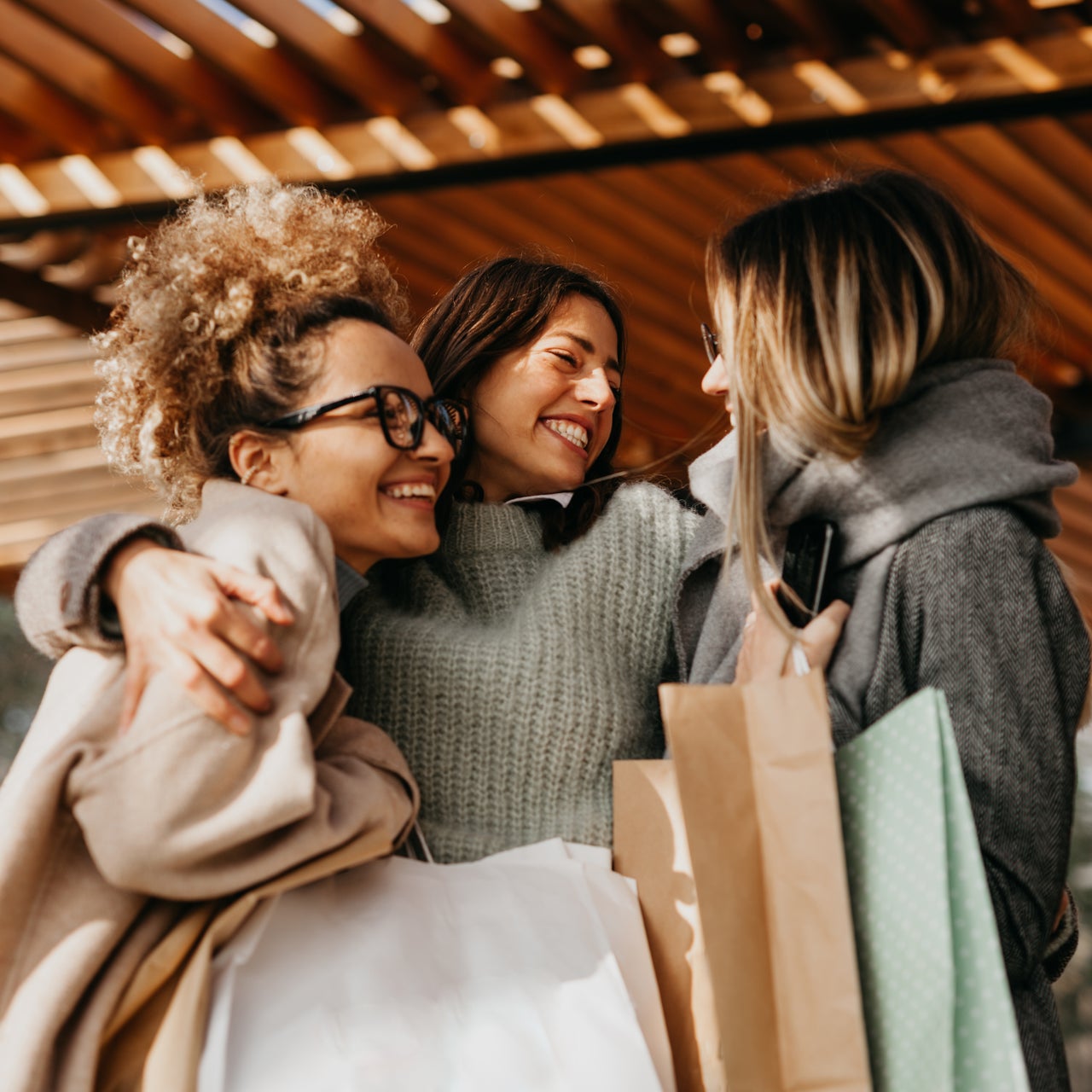Photo of excited people shopping together