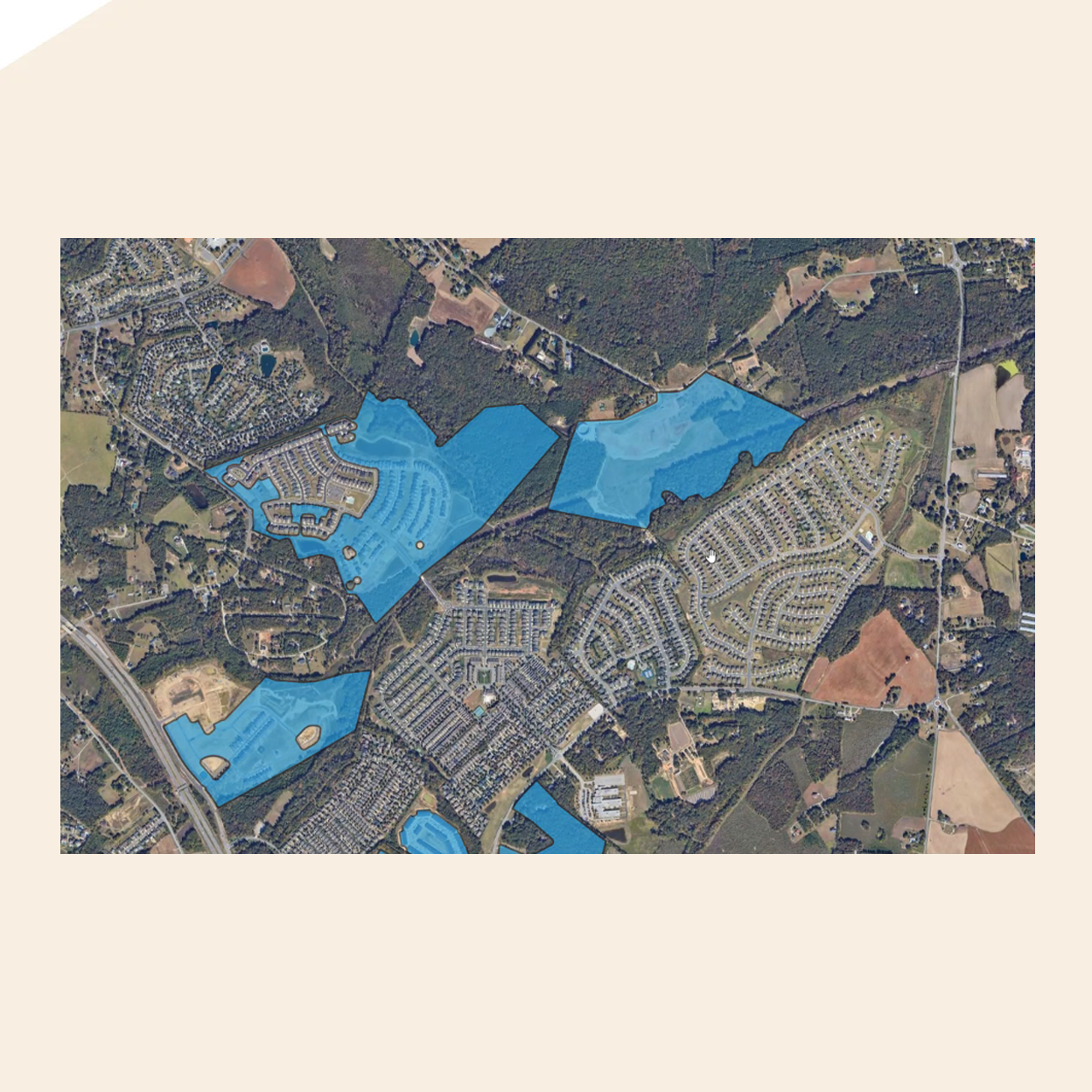 An aerial view of parcels of land and houses with areas highlighted.