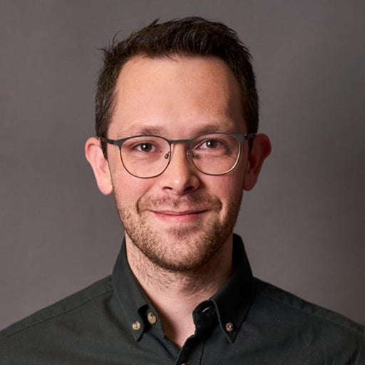 Corporate headshot of Tom Coad