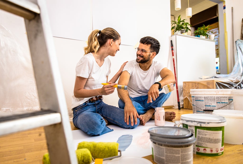 Man and woman renovating home