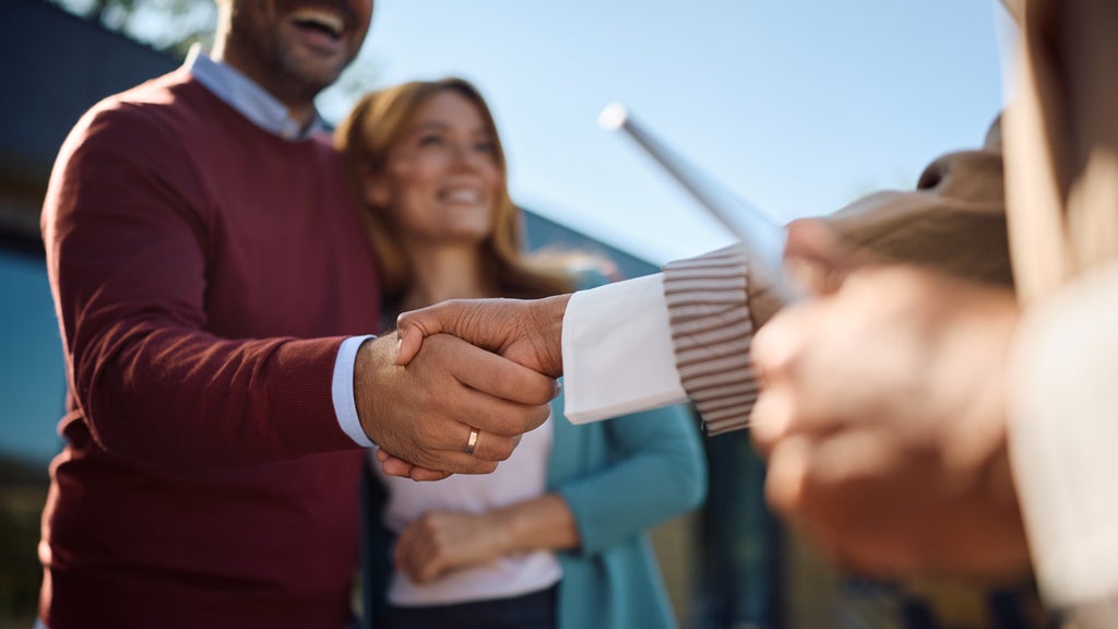 Couple buying a home and receiving a key
