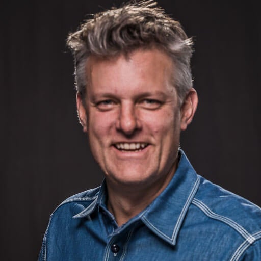 Corporate headshot of John Rogers