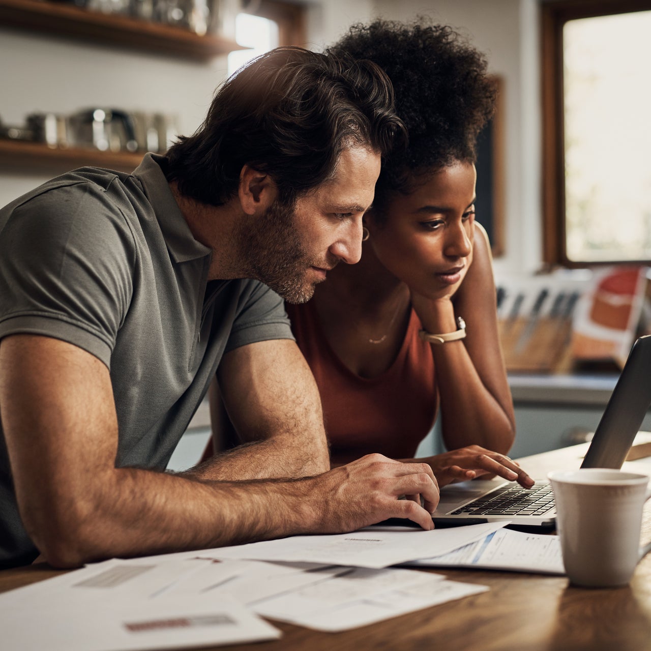 couple paperwork computer