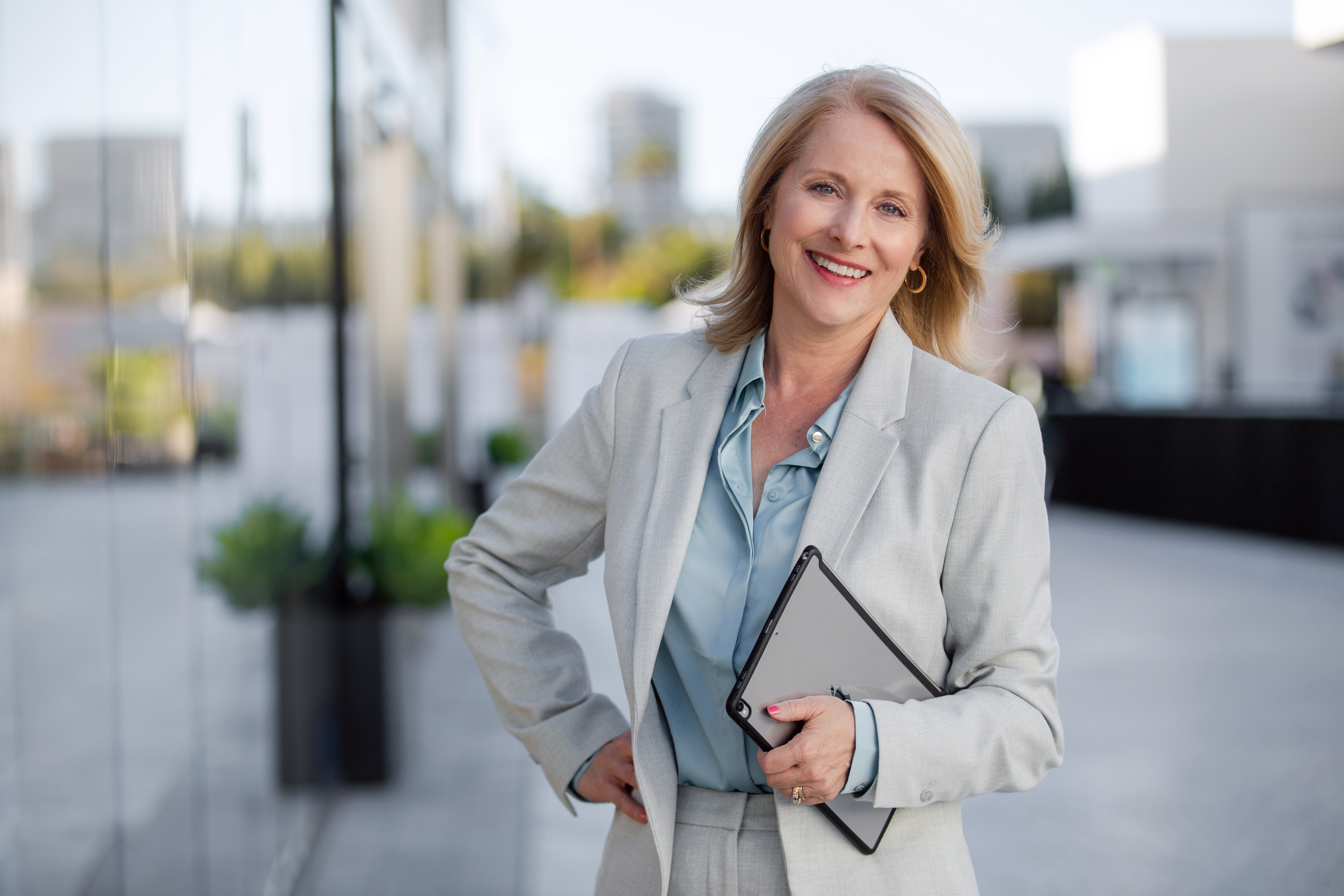 Real estate agent standing confidently and smiling