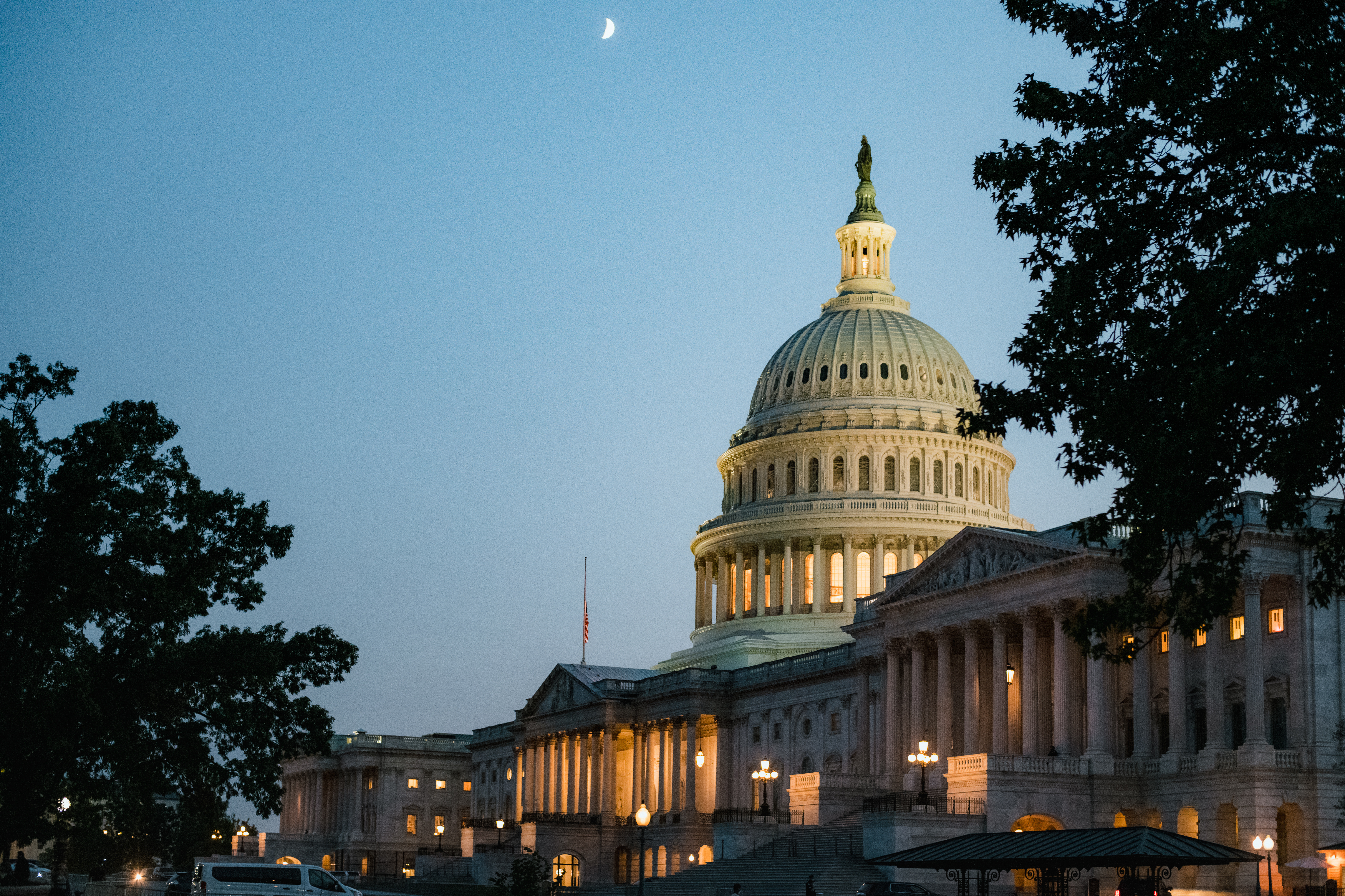 The illuminated U.S. Capitol Building at dusk, representing secure federal government property data initiatives.