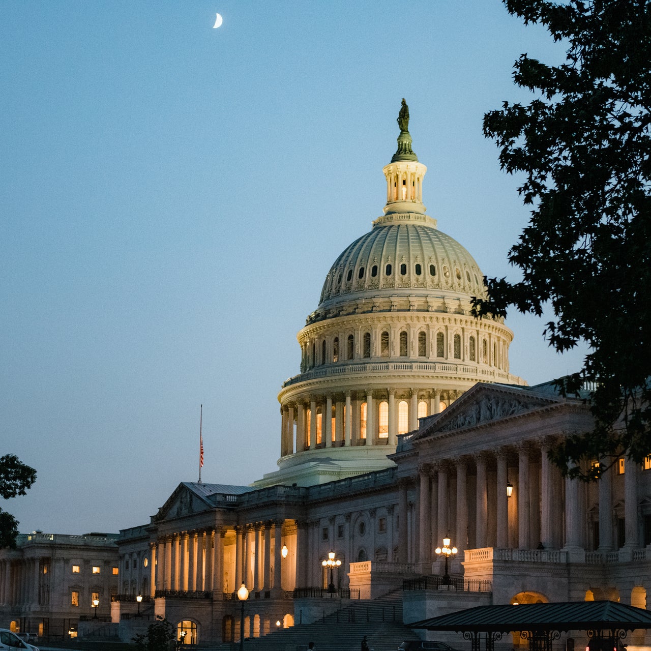 The illuminated U.S. Capitol Building at dusk, representing secure federal government property data initiatives.
