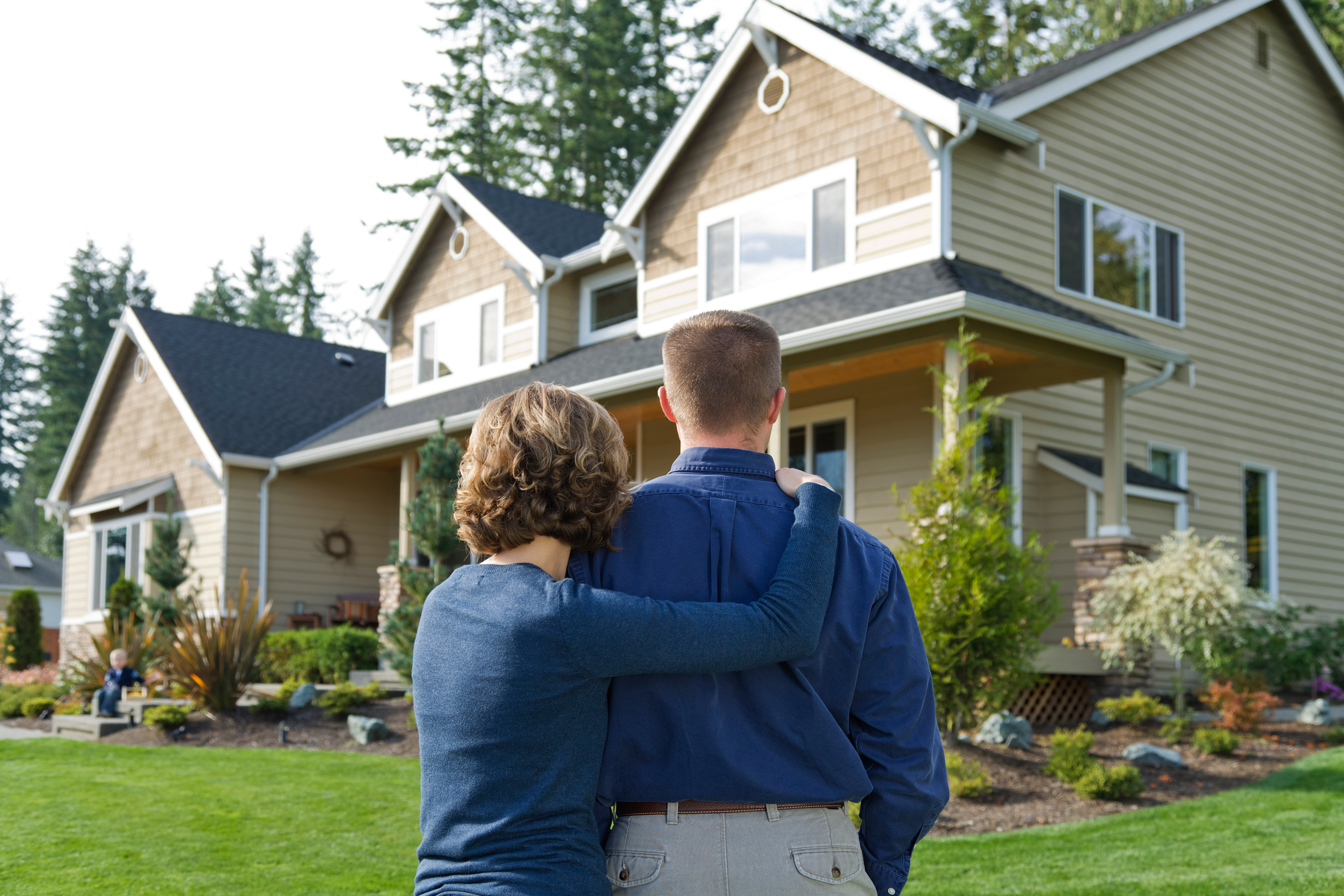 Mother and son looking at an inherited family house