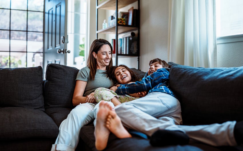 Young family on the couch together.