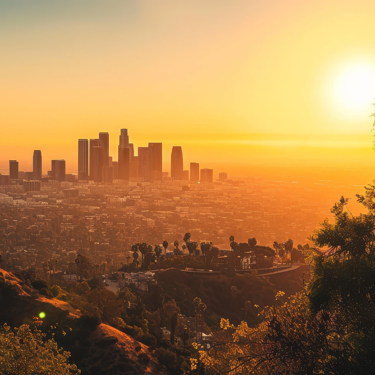 An aerial view of a city landscape with skyscrapers and some scattered greenery around during the sunset.