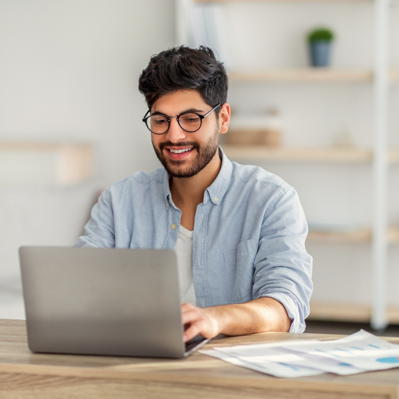 Agent using a laptop to enter a listing