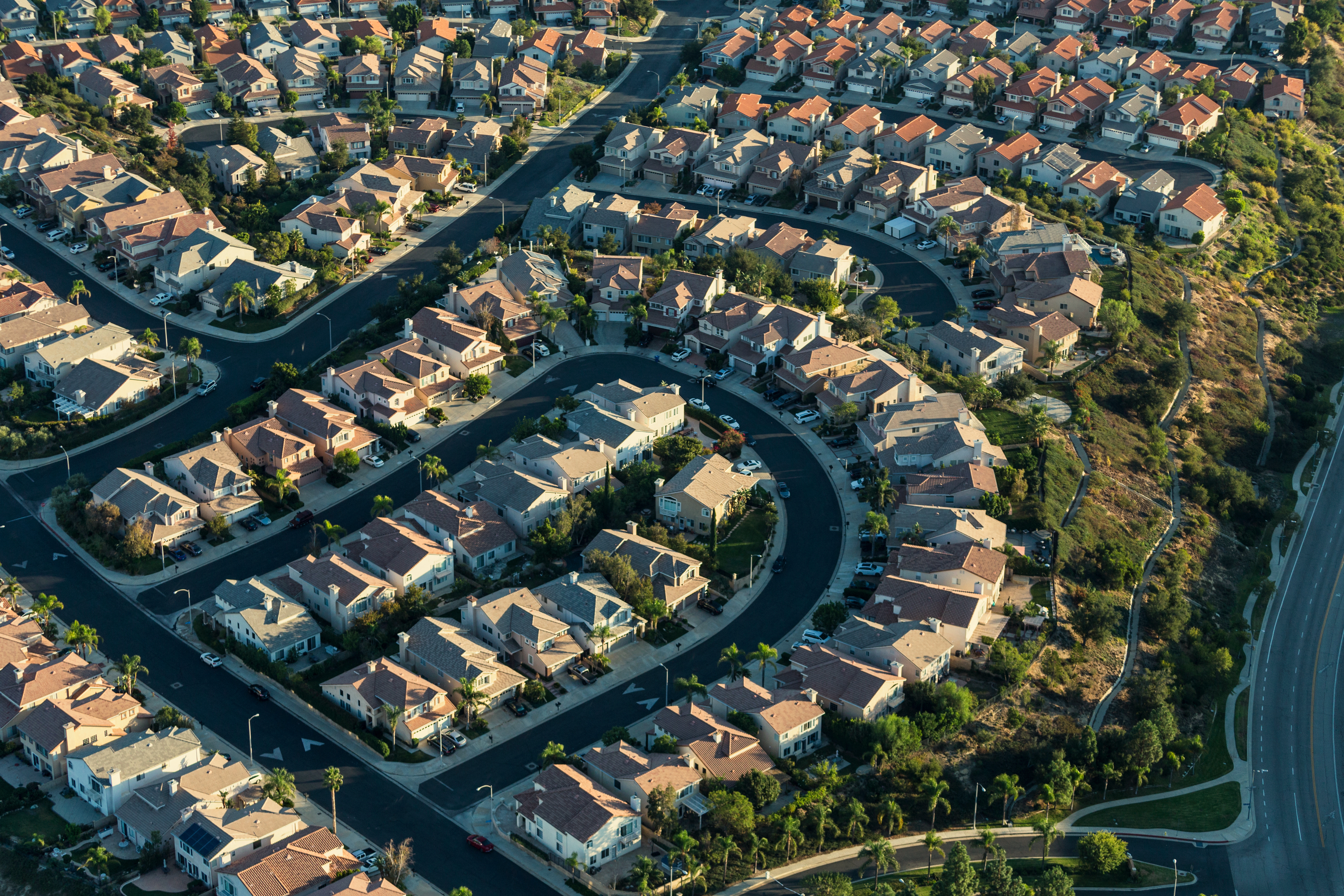 An aerial view of a suburban neighborhood with numerous houses.