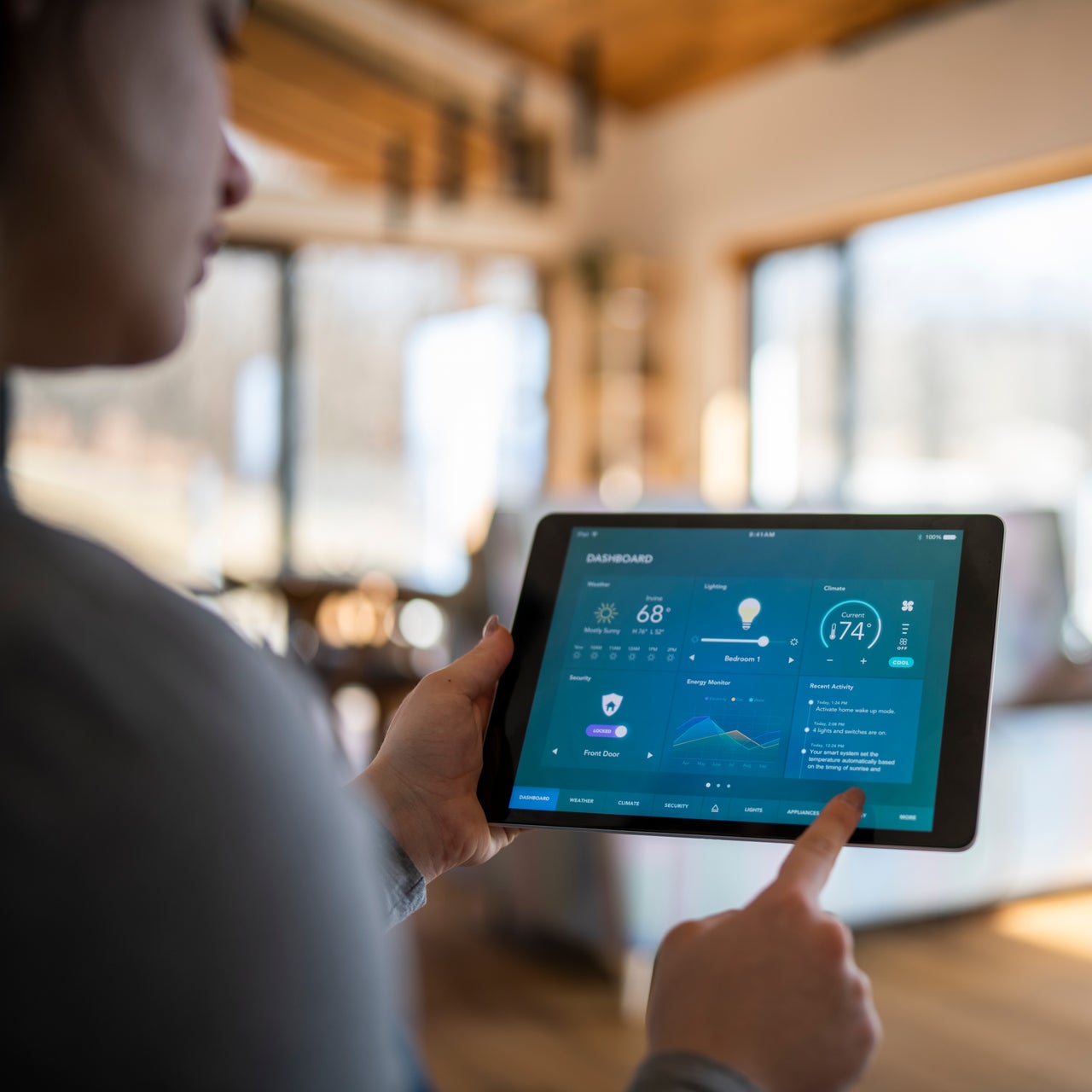 A person viewing efficiency data on a tablet