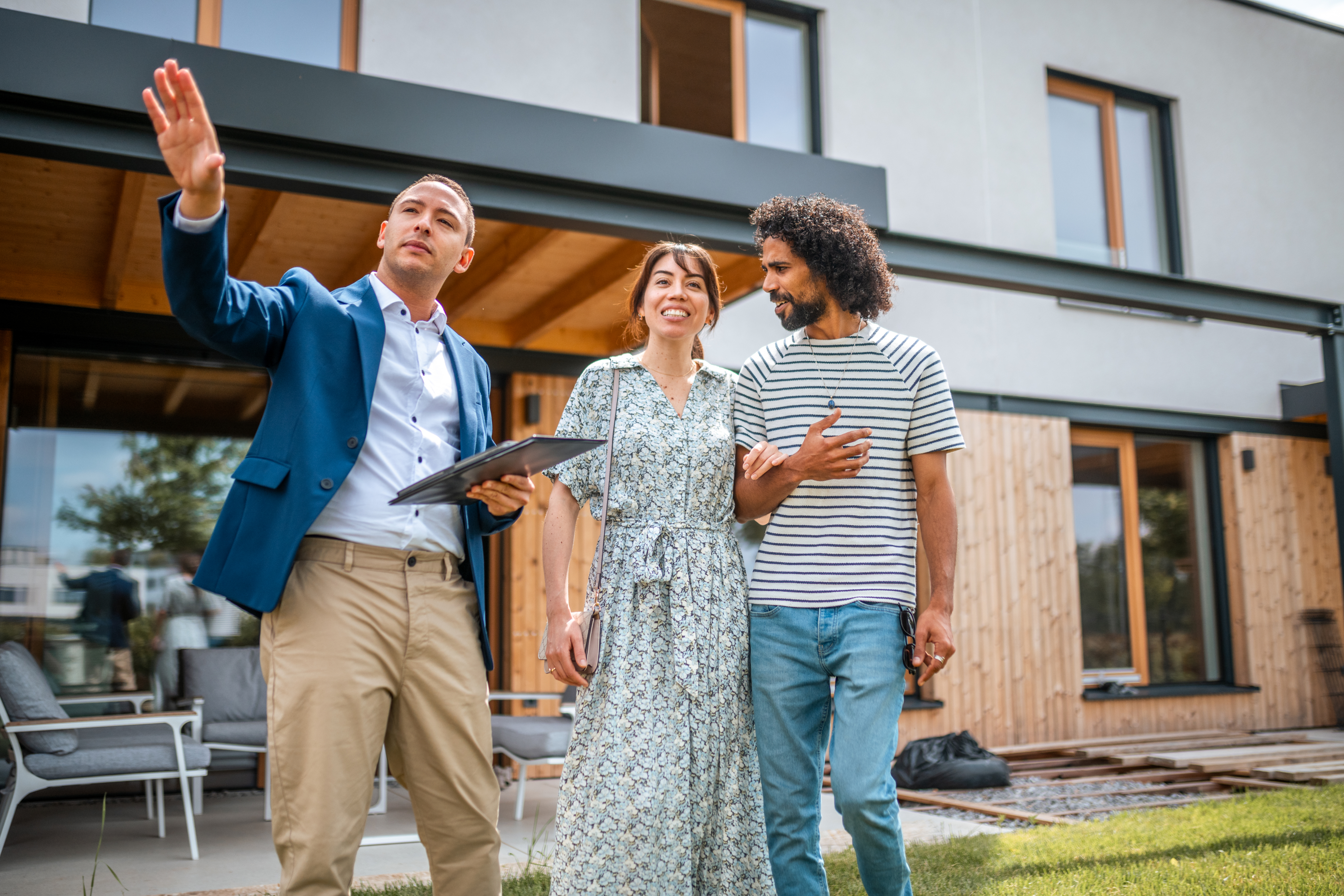 Real estate agent with young couple 