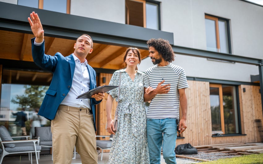 Real estate agent with young couple