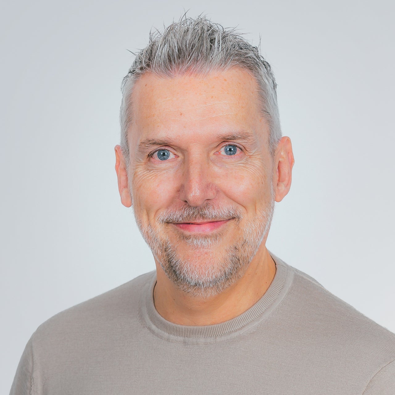 Corporate headshot of Mark Barrett