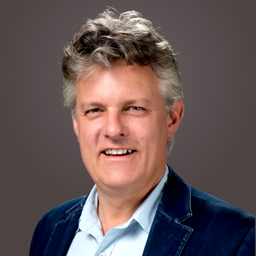 Corporate headshot of John Rogers
