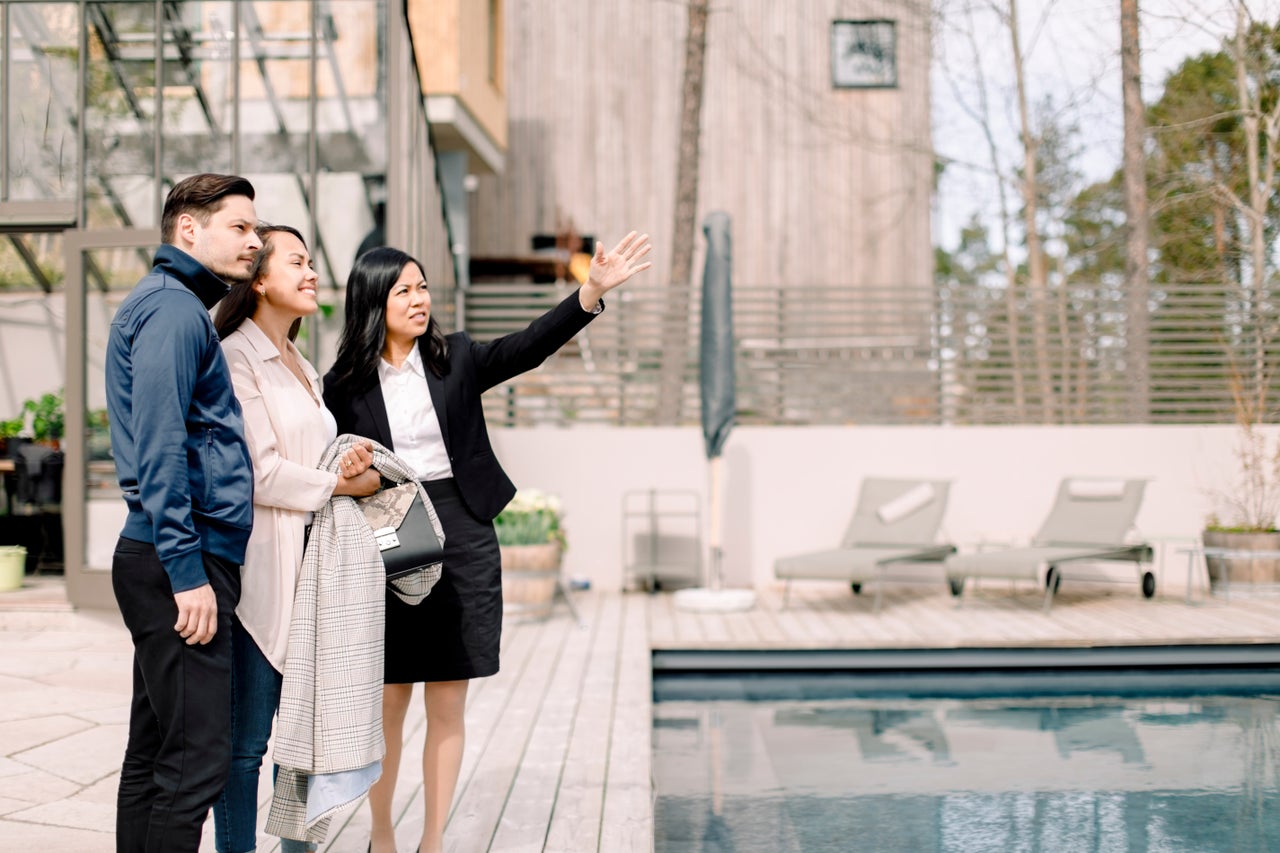 Real estate agent showing a house