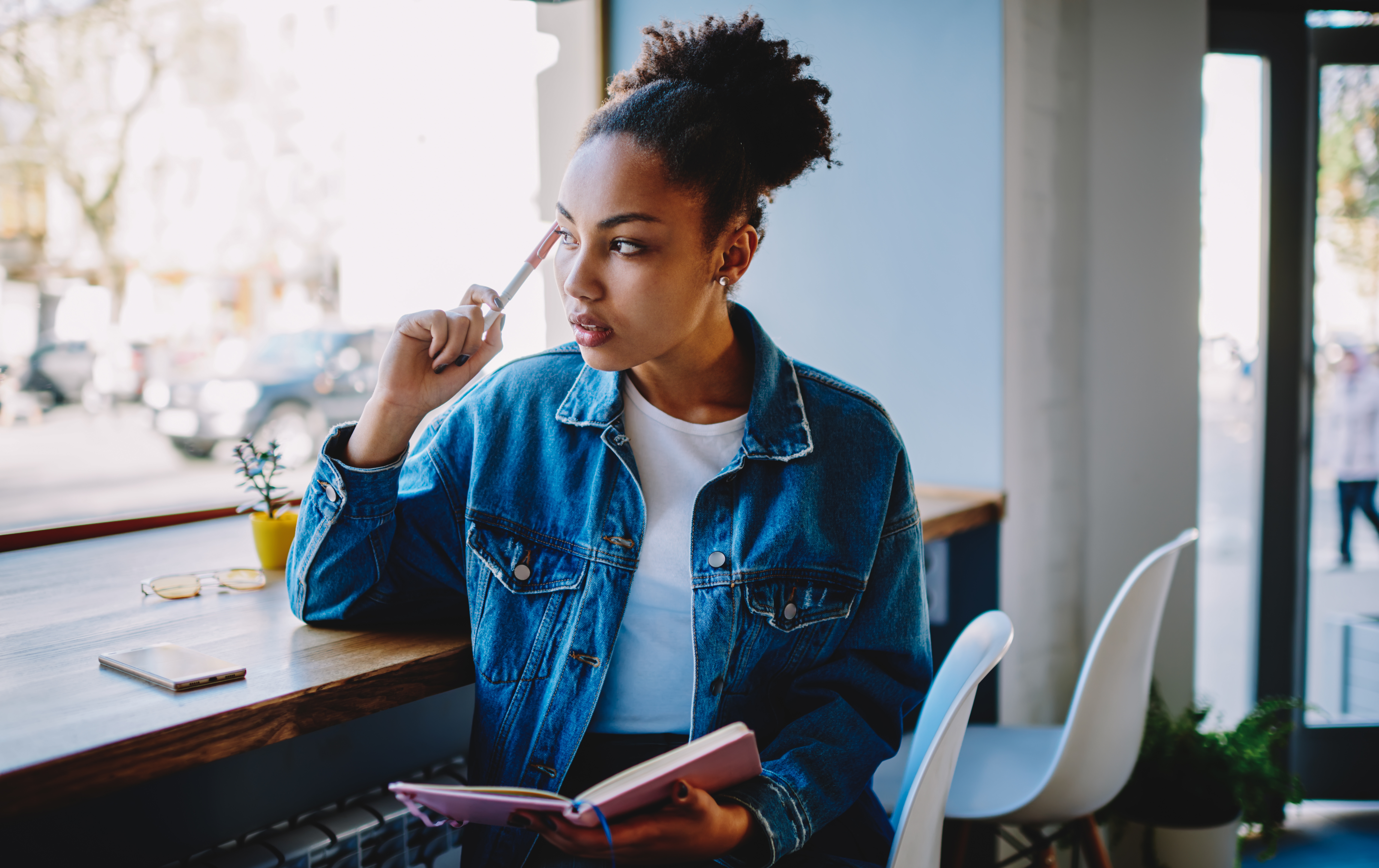 A woman studying at a coffee shop.