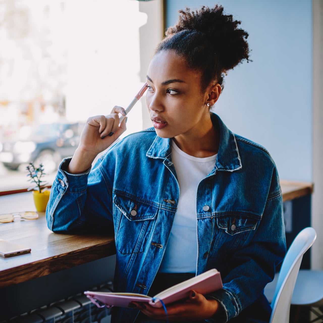 A woman studying at a coffee shop.
