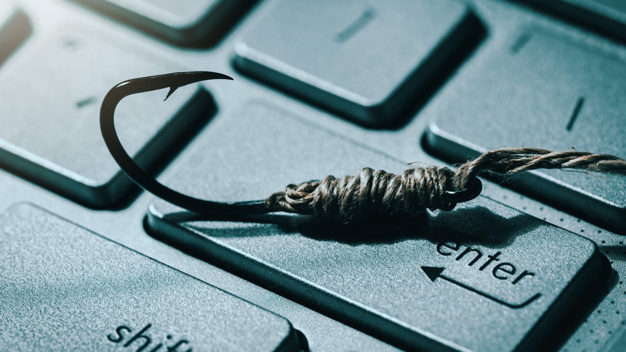A fishhook on a keyboard