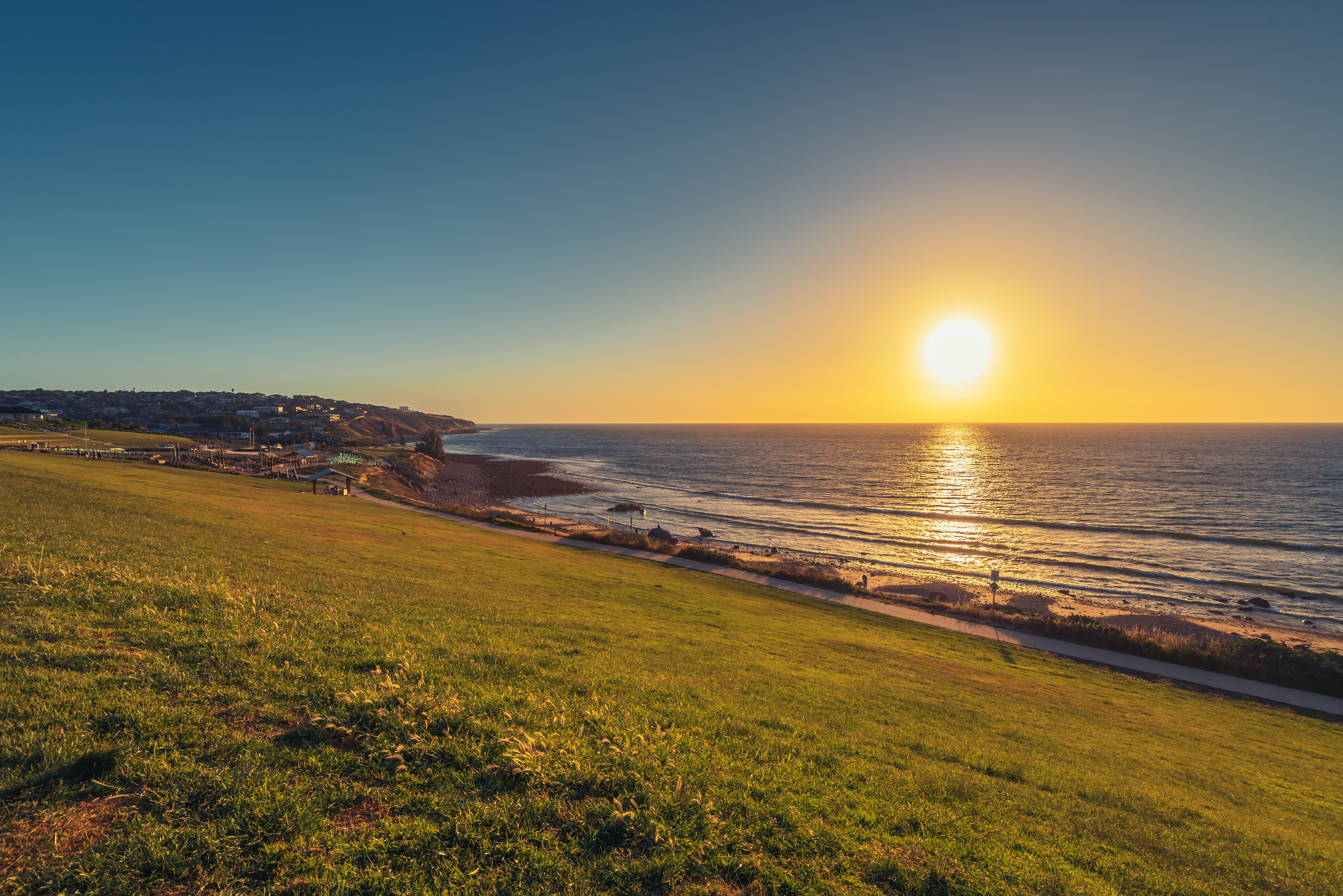 Hill meets sea on the coast at sunset