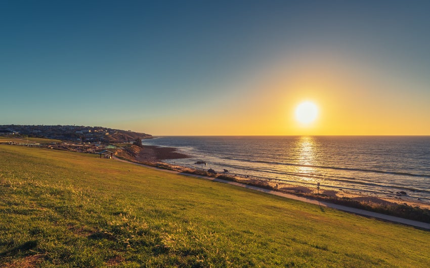 Hill meets sea on the coast at sunset