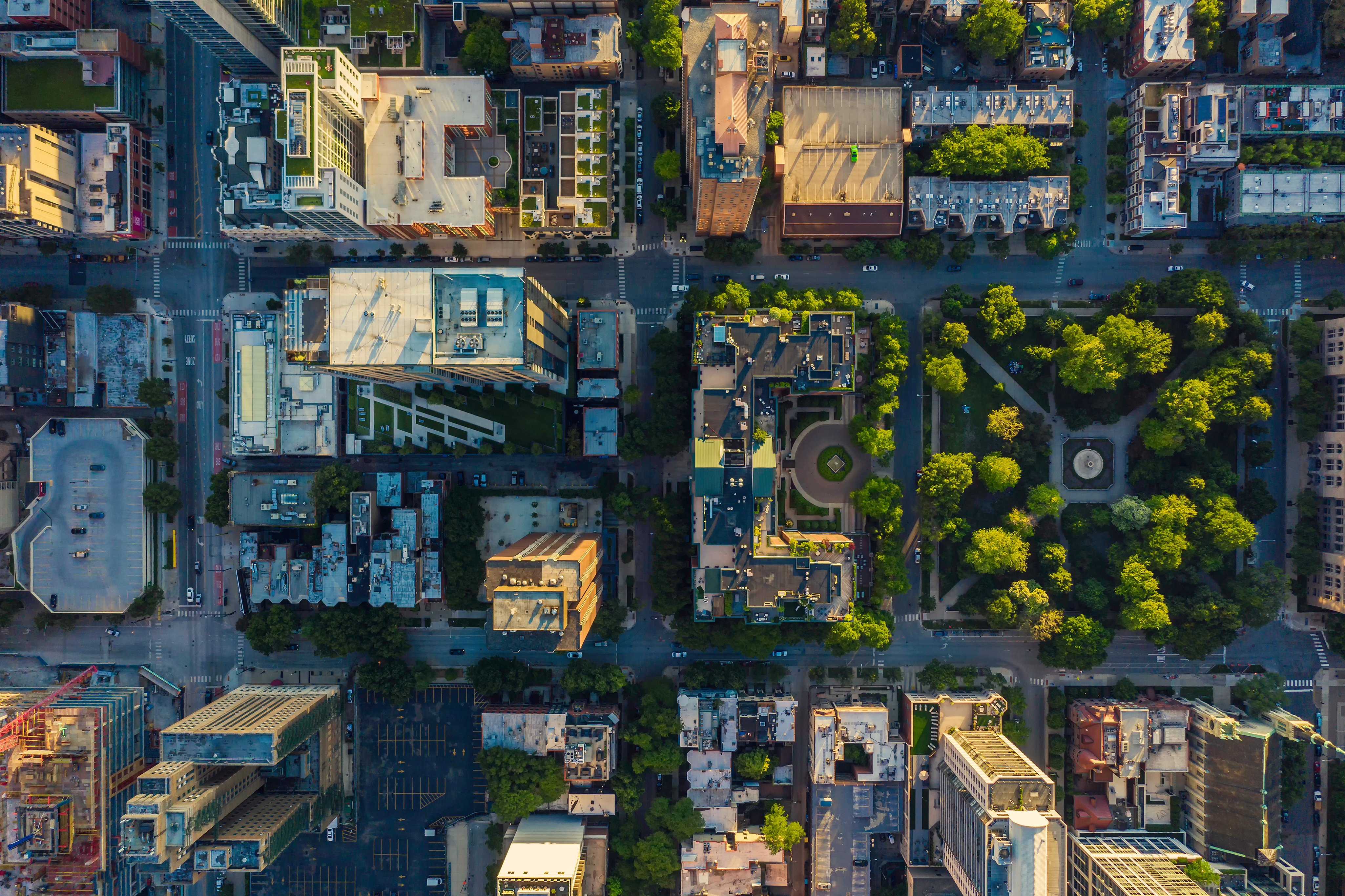 Aerial view of a large residential neighborhood at sunrise, representing a property portfolio for underwriting.