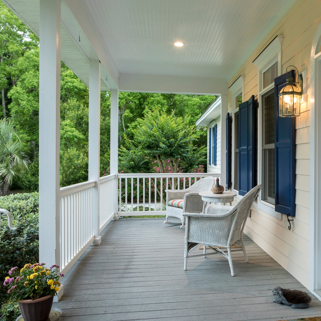 A middle class house porch with greenery.