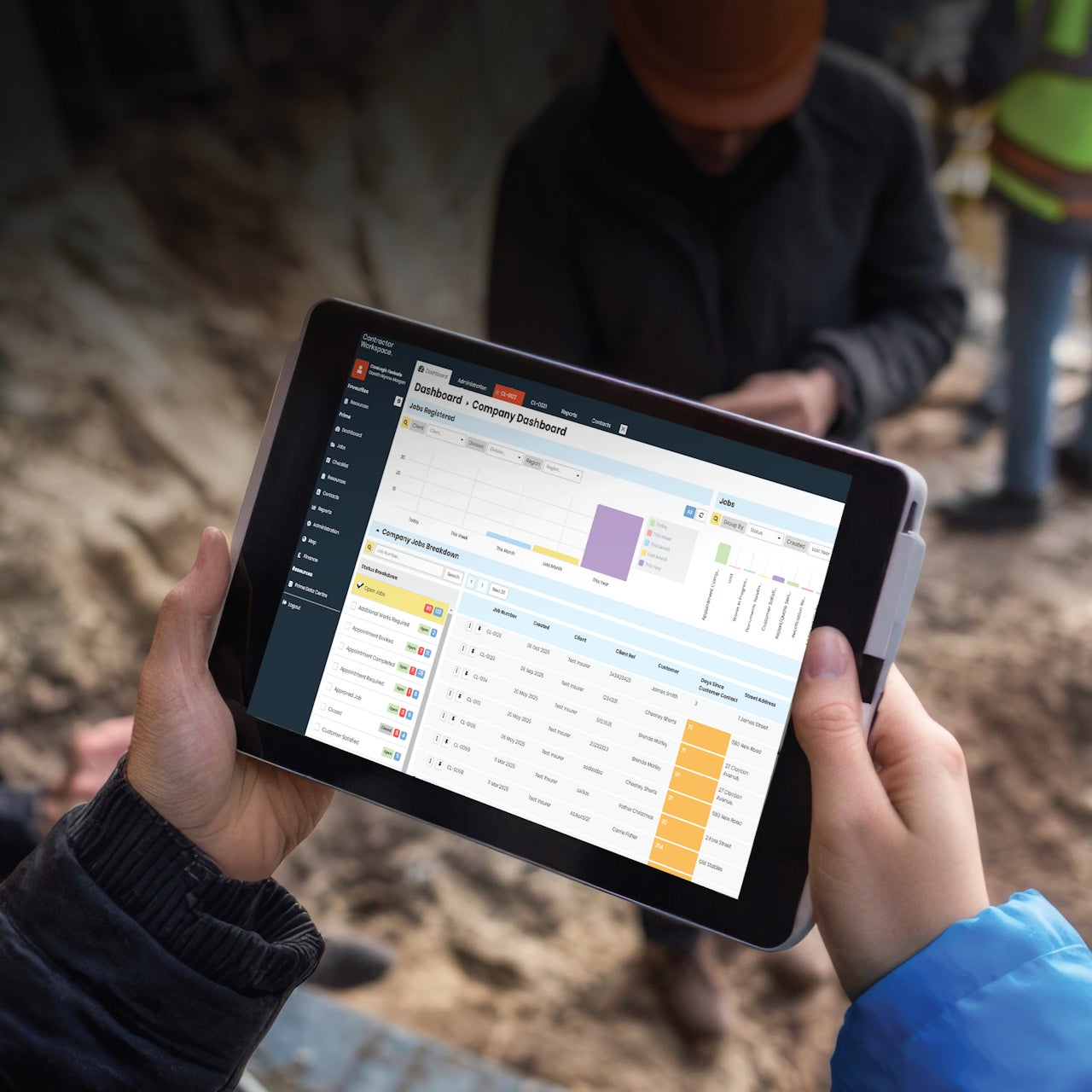 A construction worker on-site using Contractor Workspace on a tablet