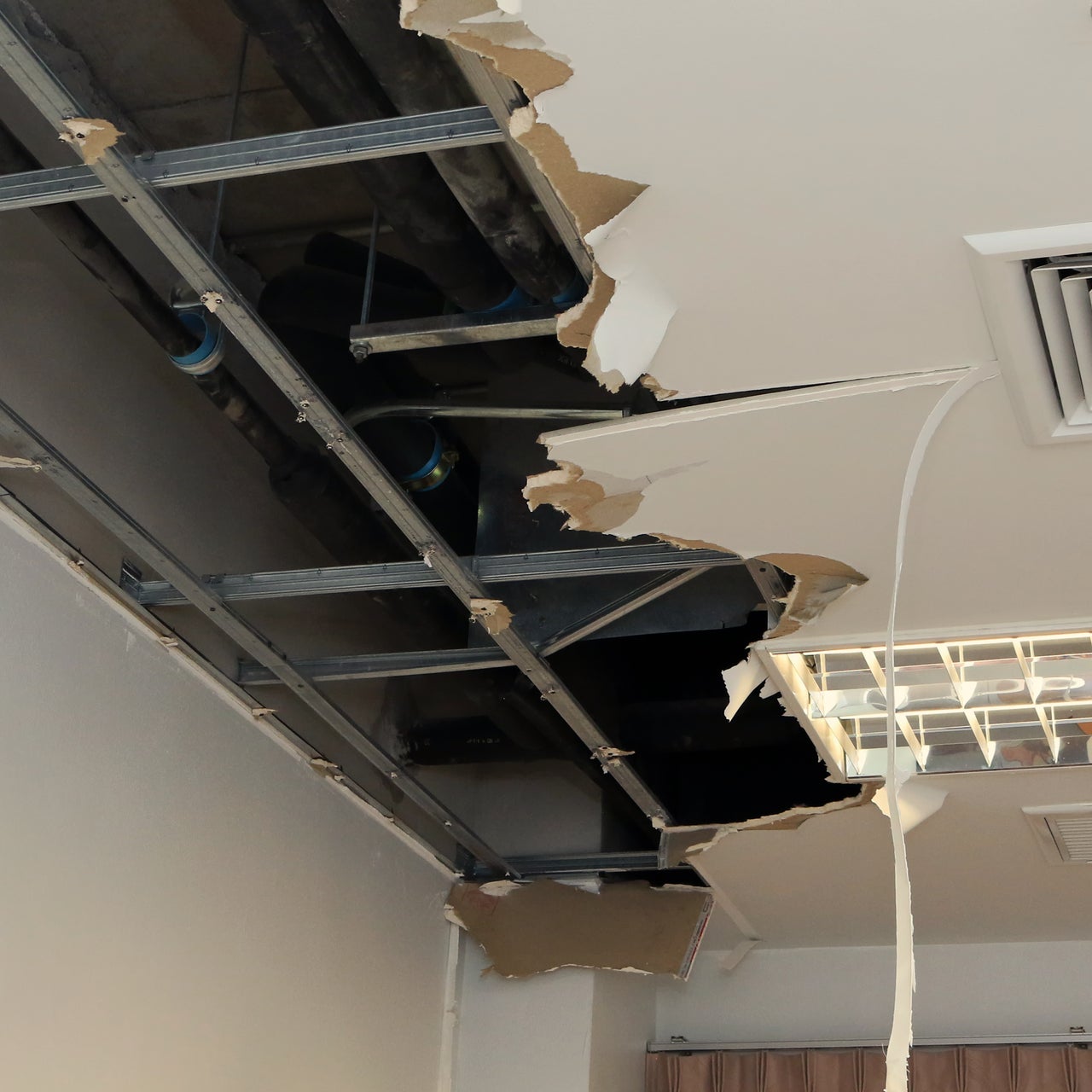 A damaged ceiling of a room.