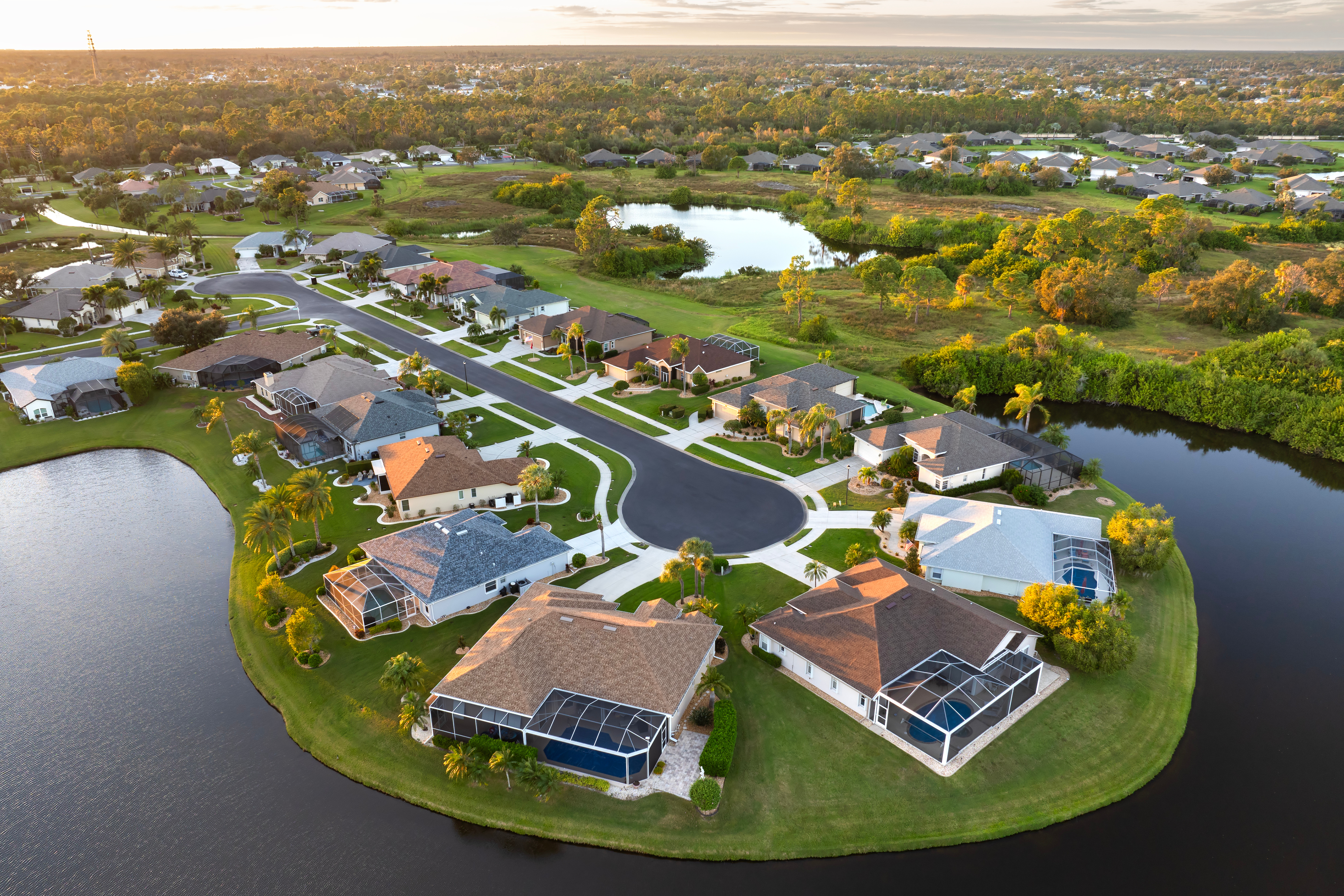 An aerial view of a suburban neighborhood with streams of water.