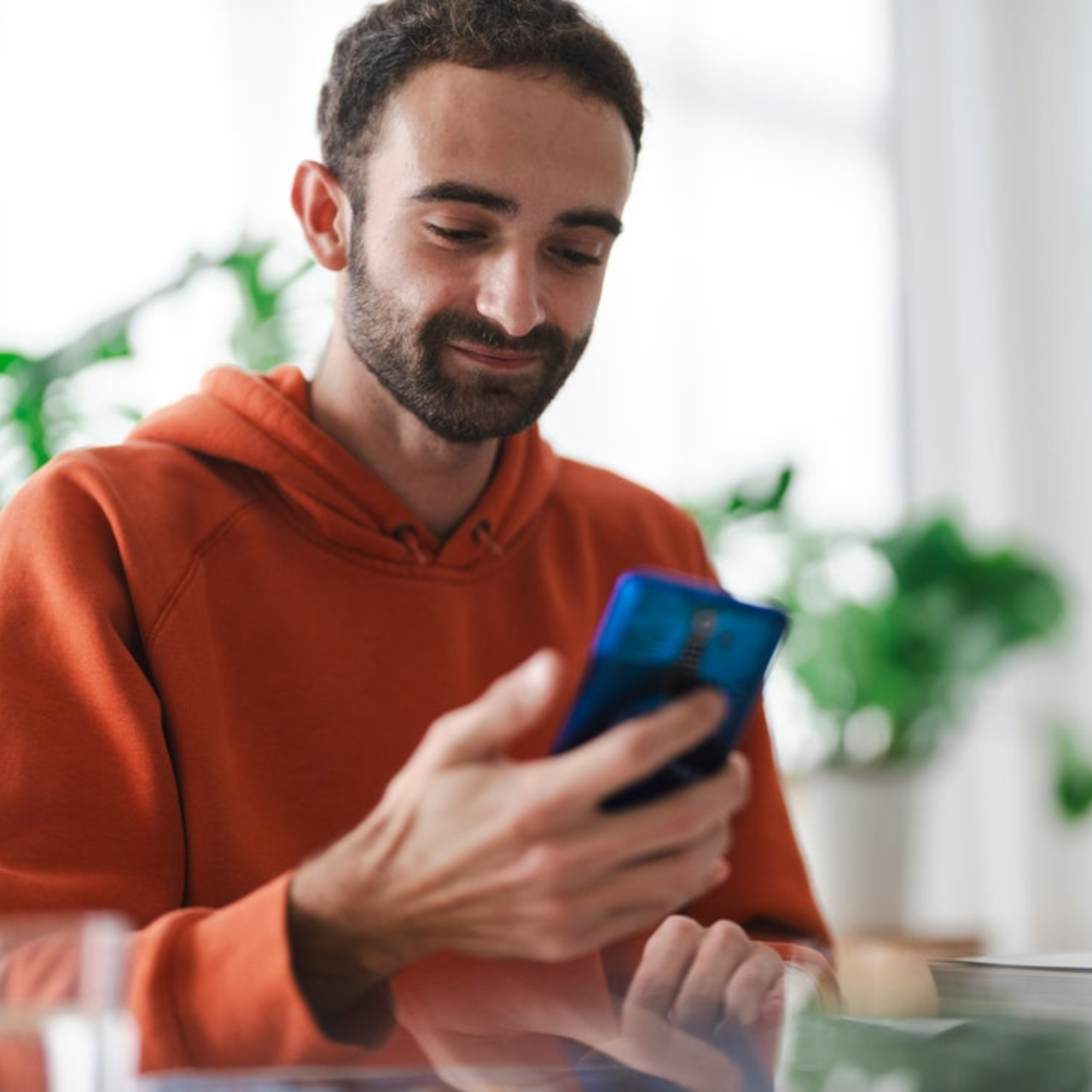 Real estate agent smiling and looking at their phone