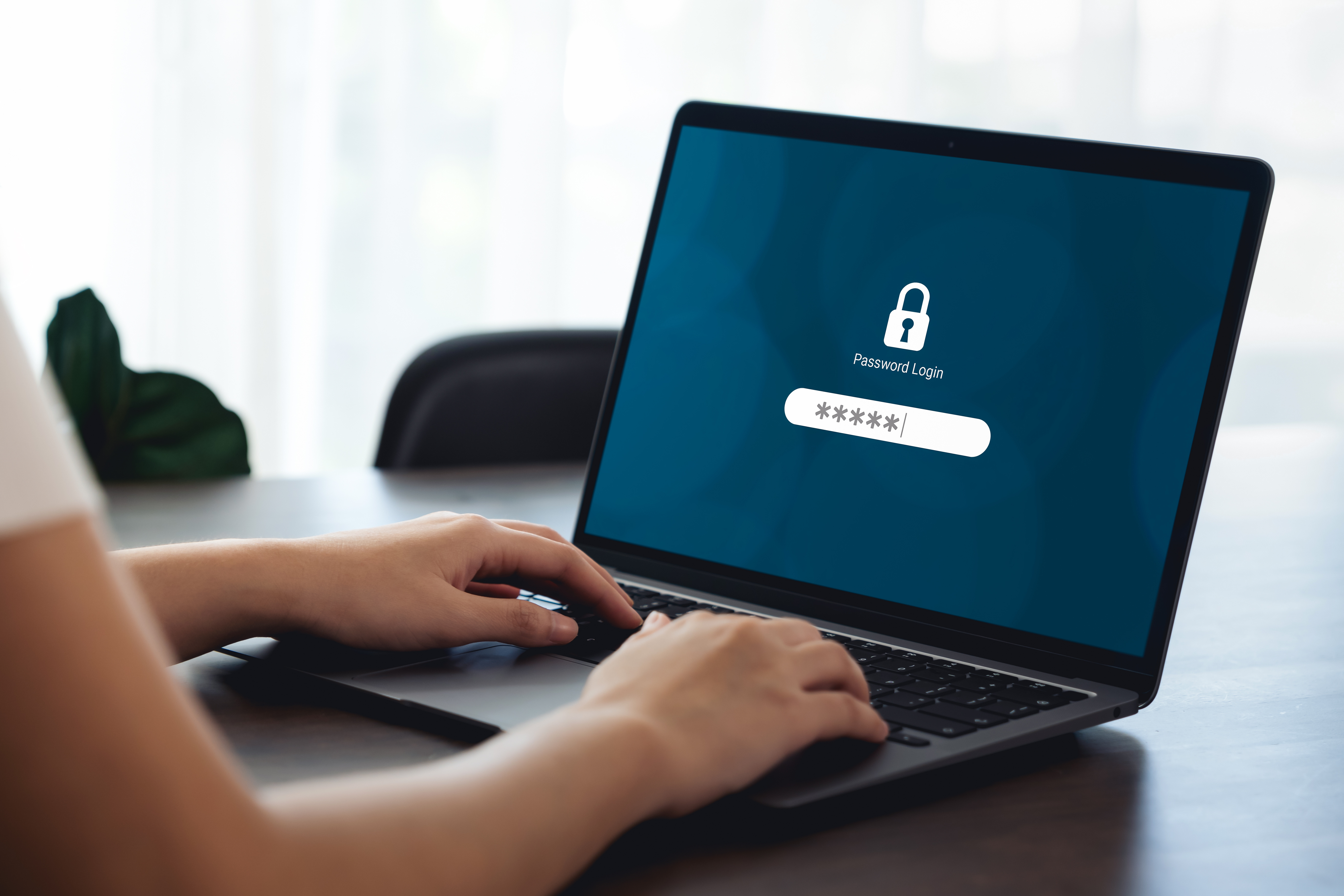 Several passwords written down on a notebook pad.