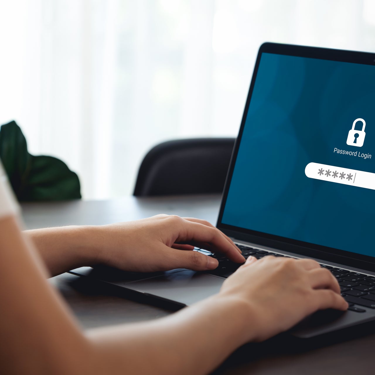 Several passwords written down on a notebook pad.