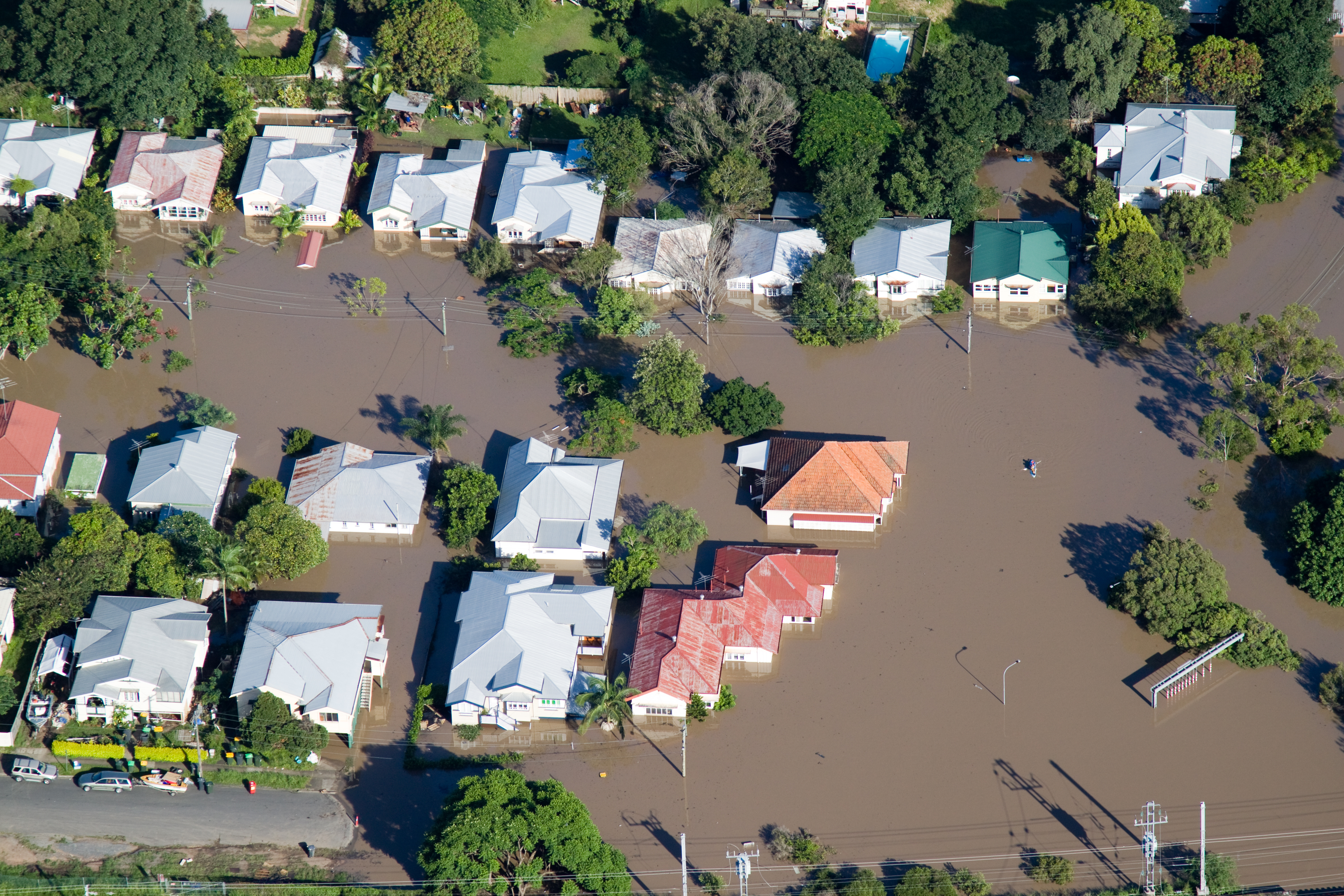An aerial view of flood repair work in a residential area.