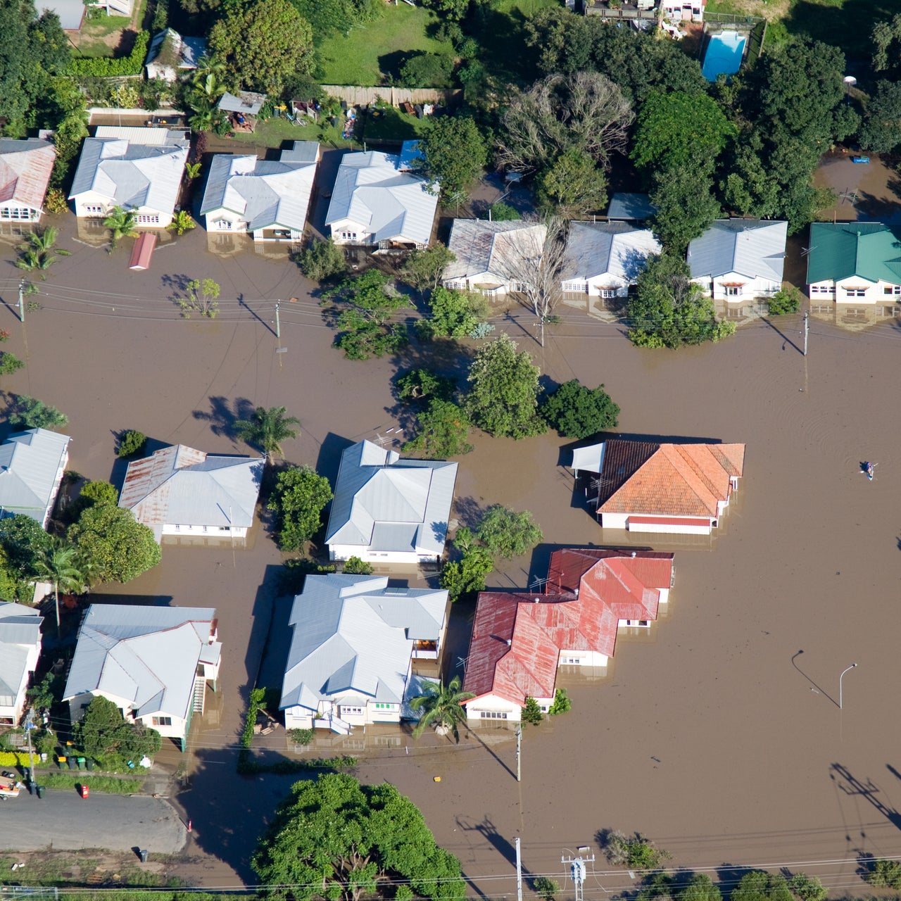 An aerial view of flood repair work in a residential area.