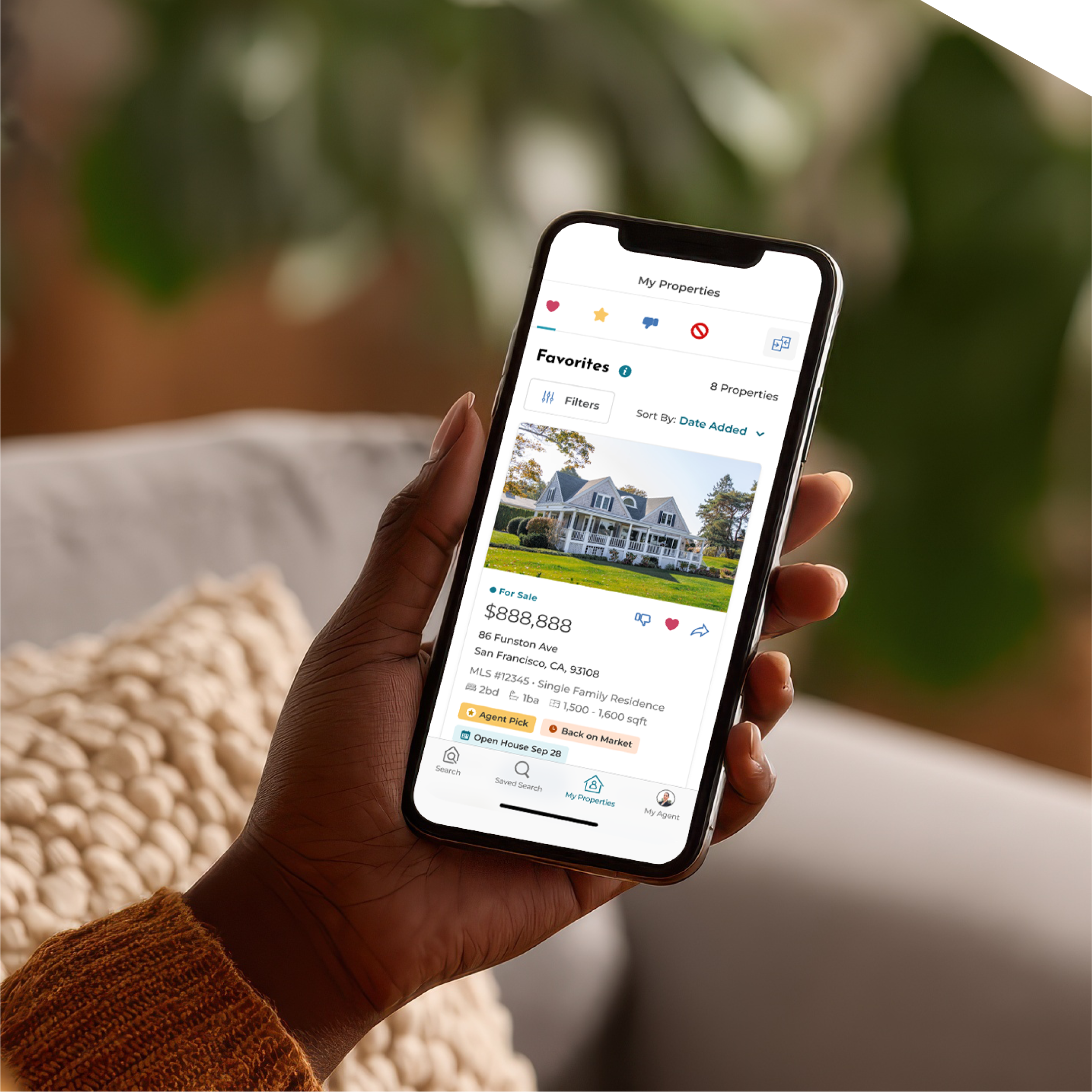 Person holding a phone looking at the OneHome mobile app