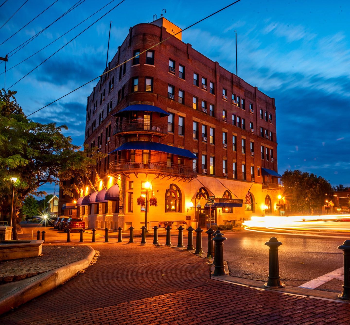 A historic building lit up at dusk in Marietta, Ohio