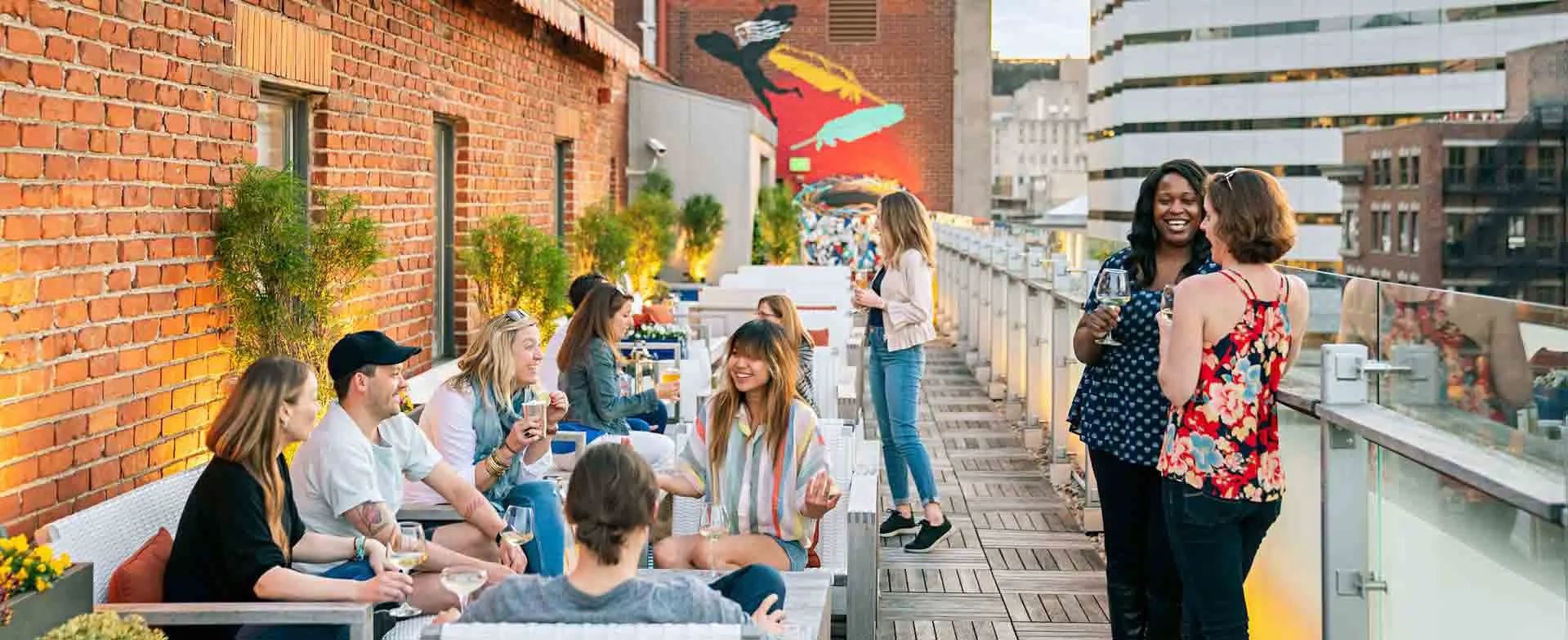 People enjoying drinks on a roof top patio