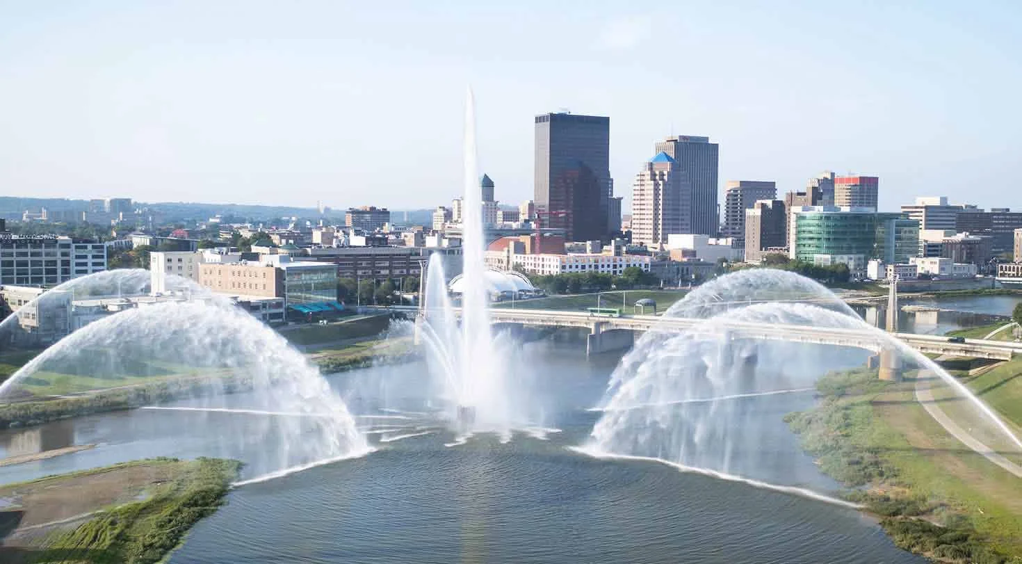 Dayton region fountains on the river with city buildings
