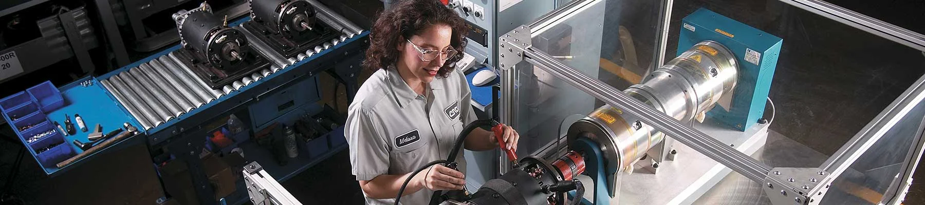 A woman working inside a Crown manufacturing facility