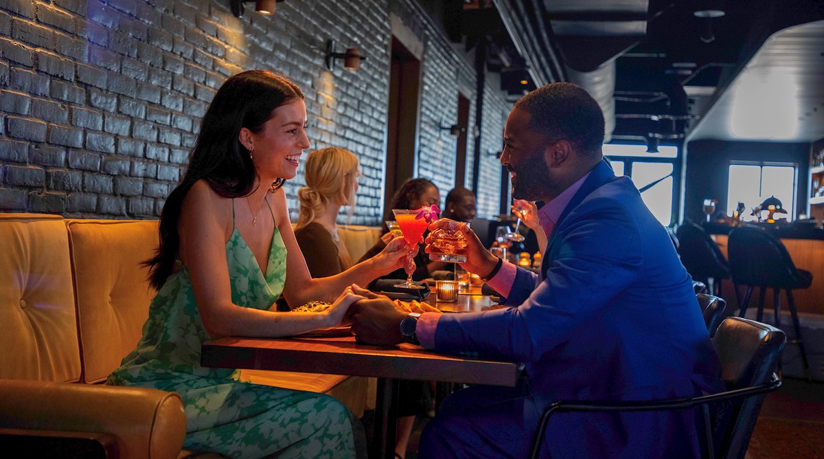 A man and woman enjoying an evening in a trendy lounge