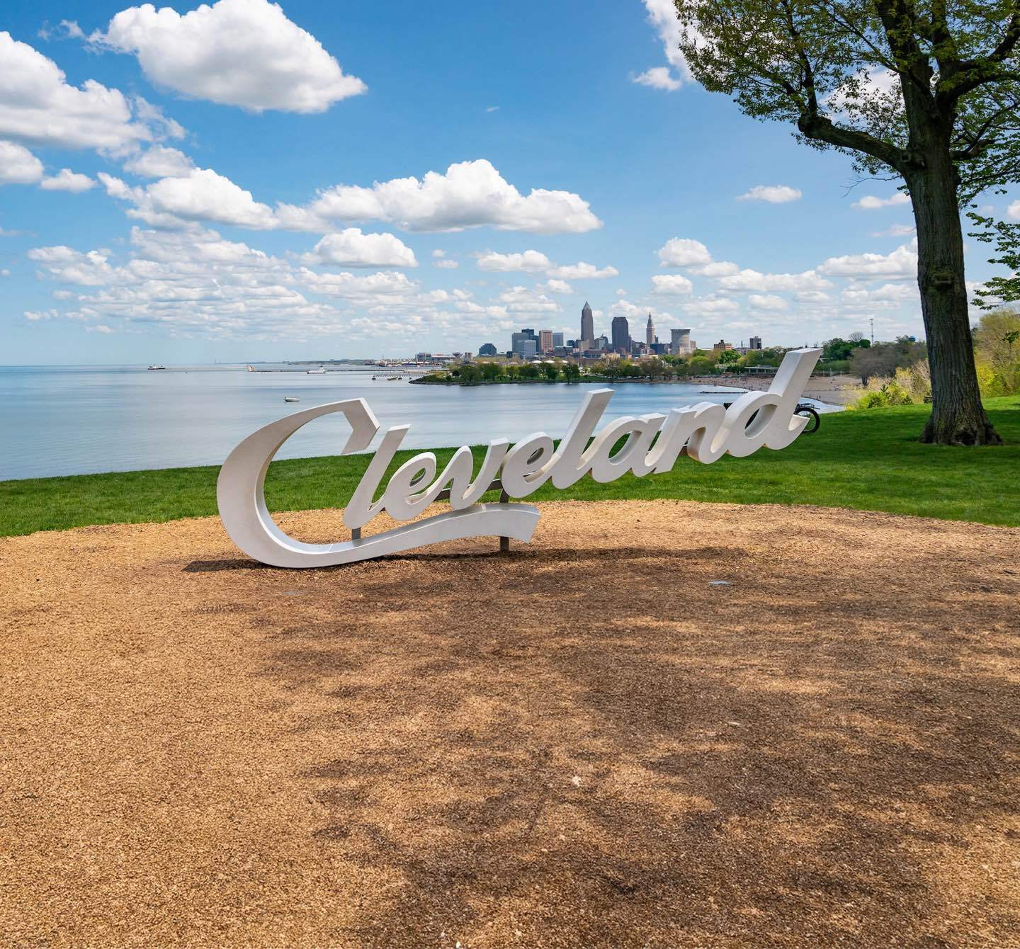 The Cleveland sign in front of the lake with the city in the background