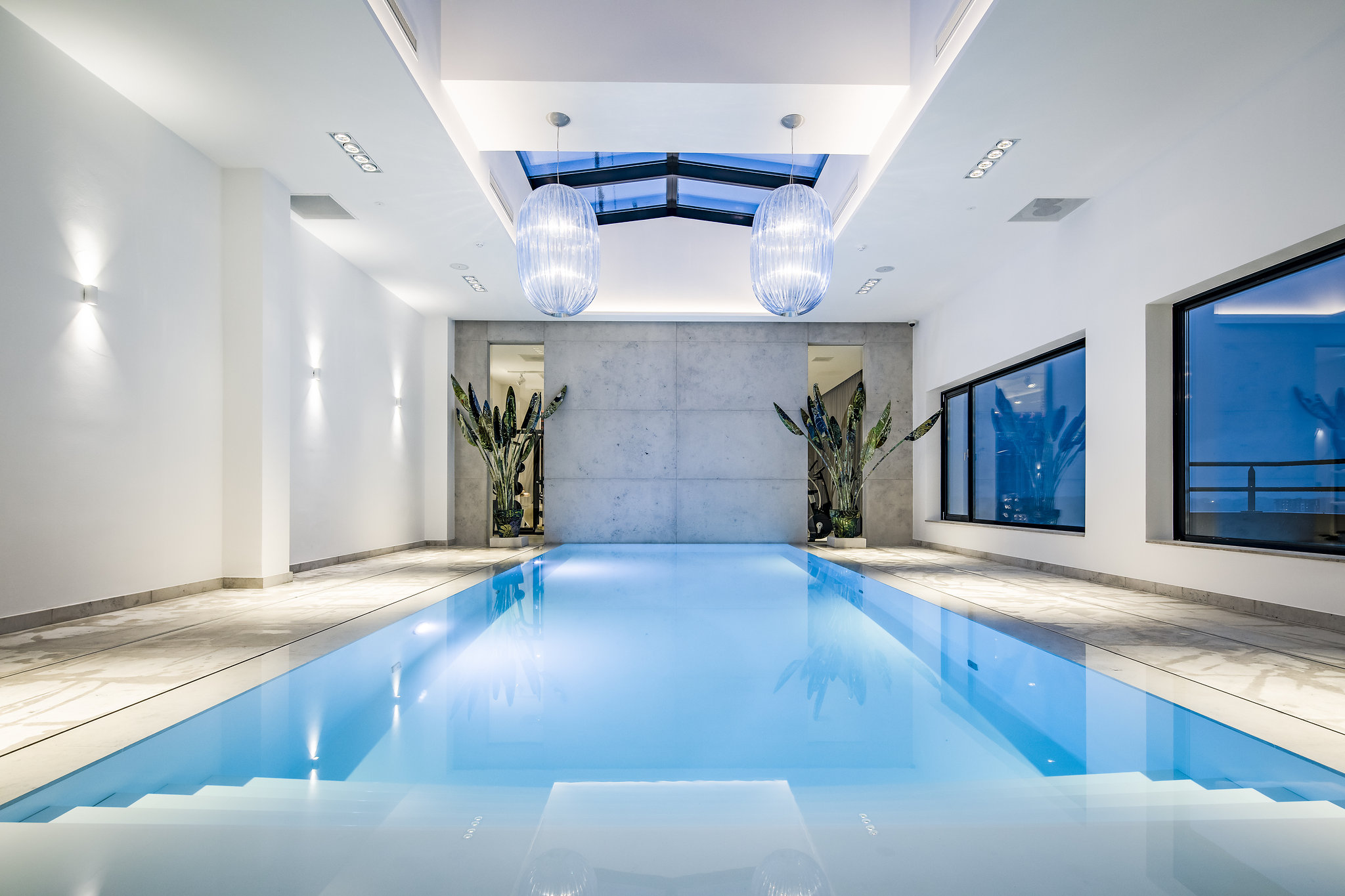A stylish pool with panoramic roof and view of Enschede